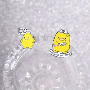 Detail view of funny medical duck enamel pins featuring humorous quotes and medical tools.