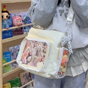 Fashionable large capacity off-white tote bag with lace trim and transparent ita bag window.