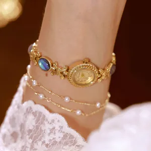 Reloj de pulsera vintage dorado con incrustaciones de concha de abulón natural para mujer