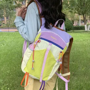 Detail view of colorful dopamine style hiking backpack with multi-compartment design