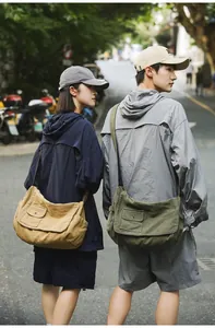 Large capacity canvas messenger bags for men and women in olive green and khaki.