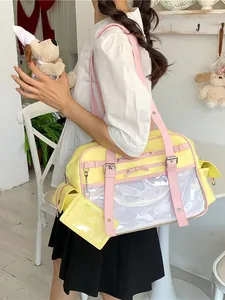 Cute Japanese style yellow and pink shoulder bag with a transparent display pocket for dolls