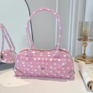 Pink polka dot transparent PVC baguette handbag showing detailed texture and design