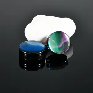Detail view of smooth glass ear plugs with iridescent blue and green-purple finish