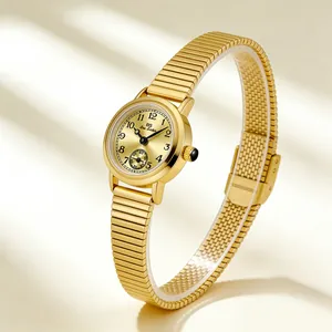 Detailed view of a gold vintage women's watch with a bamboo style stretch bracelet band