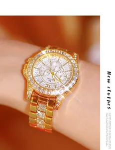 Luxury gold-tone women's watch encrusted with brilliant crystals and faceted stones