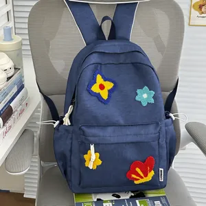 Cute navy blue school backpack with colorful embroidered flower patches and large capacity