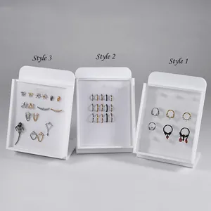 Detailed view of three acrylic jewelry display boards with clear covers