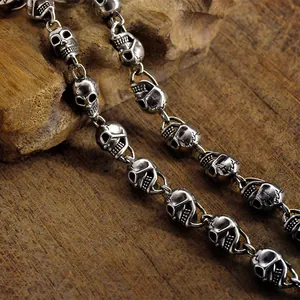 Detailed macro view of vintage silver-plated skull links chain necklace for men
