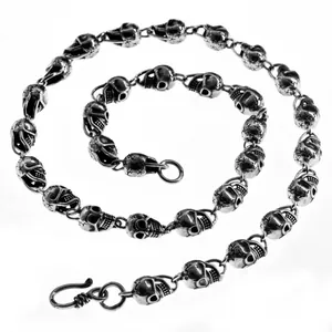 Macro view of vintage silver-plated skull link necklace in retro hip-hop style