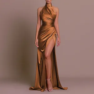 Detail of a bronze satin high-neck evening dress with elegant pleats and a high slit.