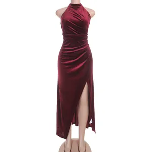 Elegant burgundy velvet halter neck dress with high side slit for evening party wear.
