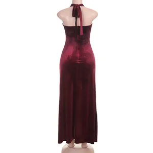 Back view of elegant wine red velvet halter neck maxi dress for evening parties