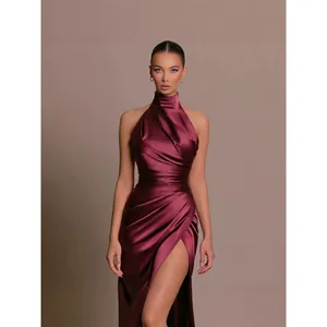 Elegant maroon satin halter neck evening gown with high slit and ruched bodycon fit