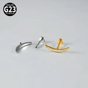 Detail view of G23 titanium crescent moon lip stud with internal thread and zirconia