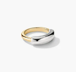 Detailed view of polished two-tone S925 sterling silver ring with minimalist curved design