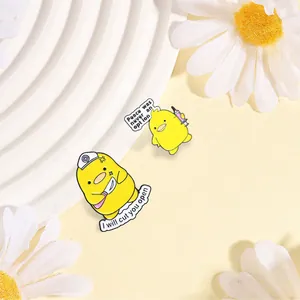 Detailed shot of funny medical yellow duck enamel pins on a decorative white background