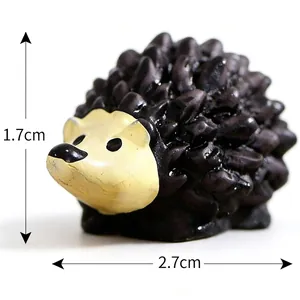 Detailed view of resin miniature hedgehog figurine with dimensions 2.7cm by 1.7cm.