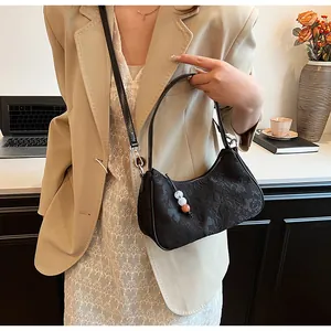 Detailed view of black New Chinese style underarm bag featuring an elegant floral pattern