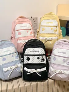 Cute Korean style large capacity student backpacks with star prints and sweet bow details