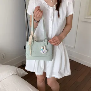 Stylish Korean style mint green handbag with floral pattern and cute rabbit charm