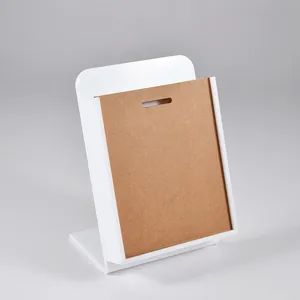 Detailed view of white acrylic jewelry display board for piercing studs and rings