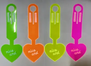 Set of four neon heart-shaped PVC luggage tags in green, orange, yellow, and pink.