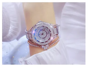 Close-up of luxury full rhinestone women's watch with elegant butterfly charm bracelet