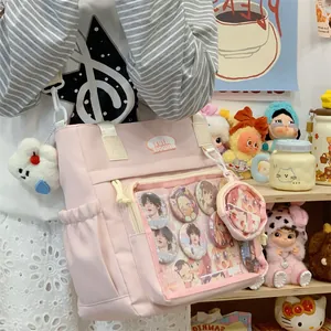 Close-up detail of the pink Ita tote bag with a transparent display pocket for pins