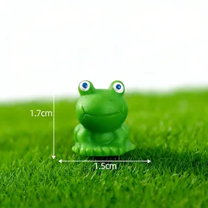 Macro view of a miniature green resin frog with 1.7cm height and 1.5cm width