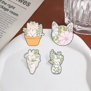 Set of four cute cartoon cat and plant enamel pins featuring forest floral theme design
