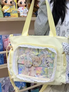 Large yellow ita bag featuring a lace transparent window for anime pin and card display