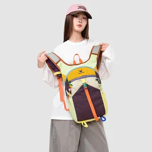 Macro detail of a vibrant multi-color outdoor backpack being worn by a young model.