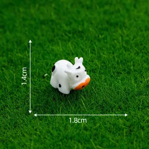 Detailed view of a miniature resin cow figurine with dimensions 1.8cm by 1.4cm