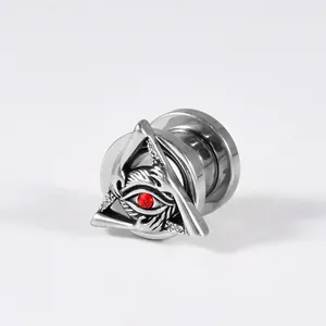Detailed view of stainless steel ear gauge featuring a triangle eye with red rhinestone