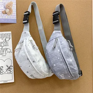 Detailed view of two trendy star patterned fanny packs in grey and white colors