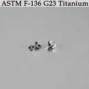 Macro view of ASTM F-136 G23 titanium dermal anchor base and clear crystal screw top