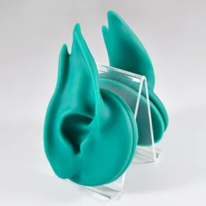 Teal silicone elf ear model on clear acrylic display stand for earrings and jewelry