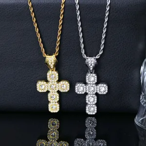 Detail view of iced out cross pendant necklaces in gold and silver hip hop style