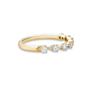Detailed side view of a gold-plated sterling silver ring with sparkling cubic zirconia