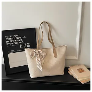 Large cream geometric embossed tote bag for women featuring a stylish decorative silk scarf