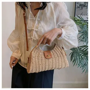 Elegant French style paper rope woven dumpling bag featuring a leather flap and crossbody strap