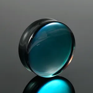 Macro view of solid black and teal AB glass ear plug expander jewelry