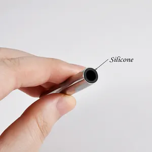 Detail shot of the stainless steel piercing sleeve tool with protective black silicone tip