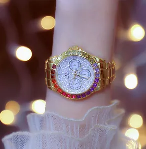 Luxury gold women's watch with rainbow crystal bezel and glitter dial detail