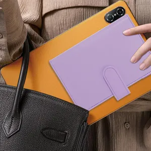 Purple A6 PU leather budget binder notebook being placed in a stylish black handbag