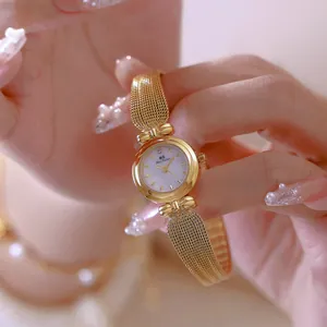 Elegante reloj dorado Bee Sister con correa de espiga y esfera blanca clásica