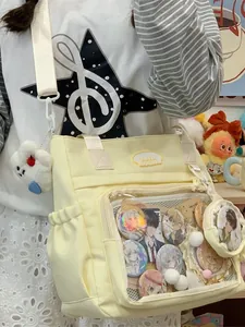 Stylish light yellow canvas ita-bag with transparent display window and plush cloud charm