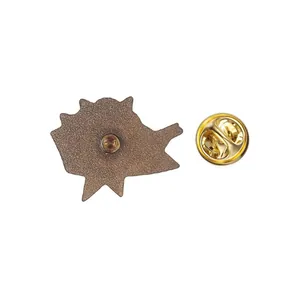 Back view of vintage metal enamel pin badge with golden butterfly clutch backing