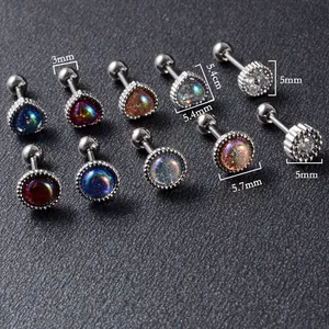 Detailed view of iridescent heart and round ear studs with clear 3mm to 5.7mm dimensions